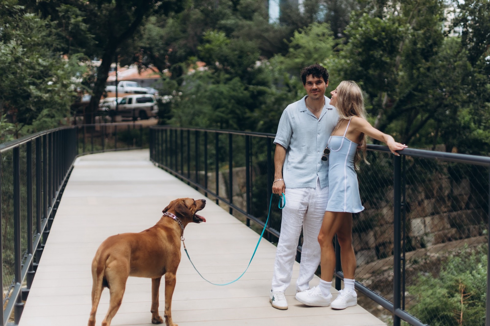 Hunter and Mary with their dog on the bridge