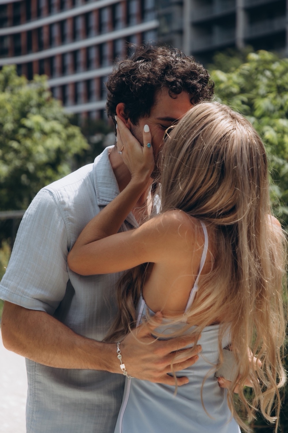 Hunter and Mary kissing on the pedestrian bridge