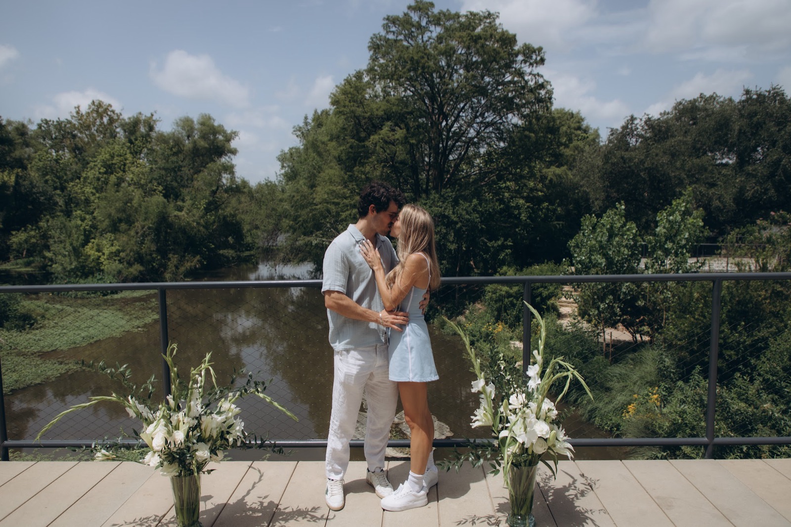 Hunter proposing to Mary on the deck over the creek