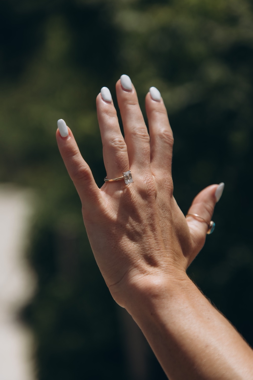 A close-up of the engagement ring on Mary's hand