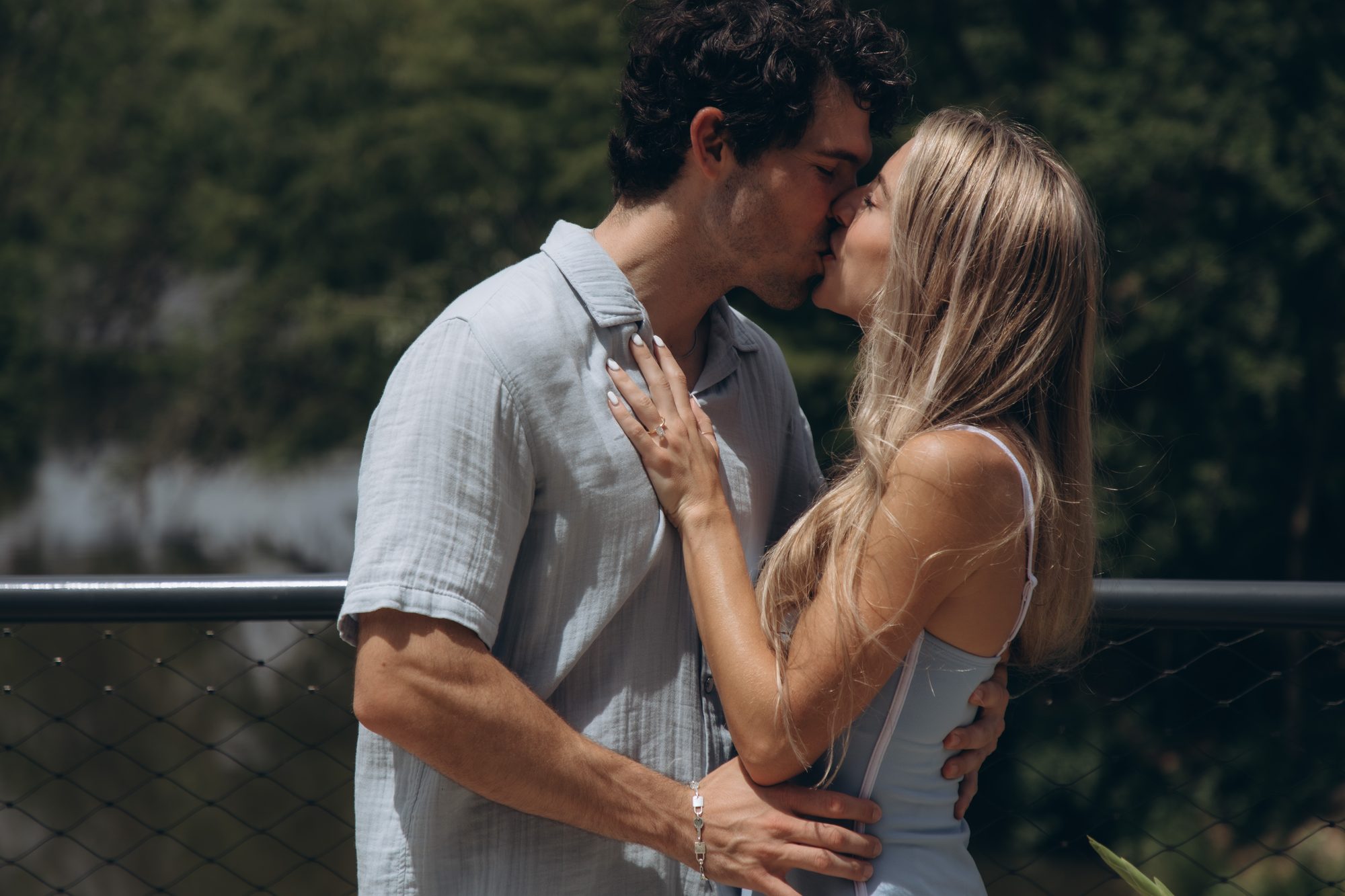 Hunter and Mary kissing on the bridge