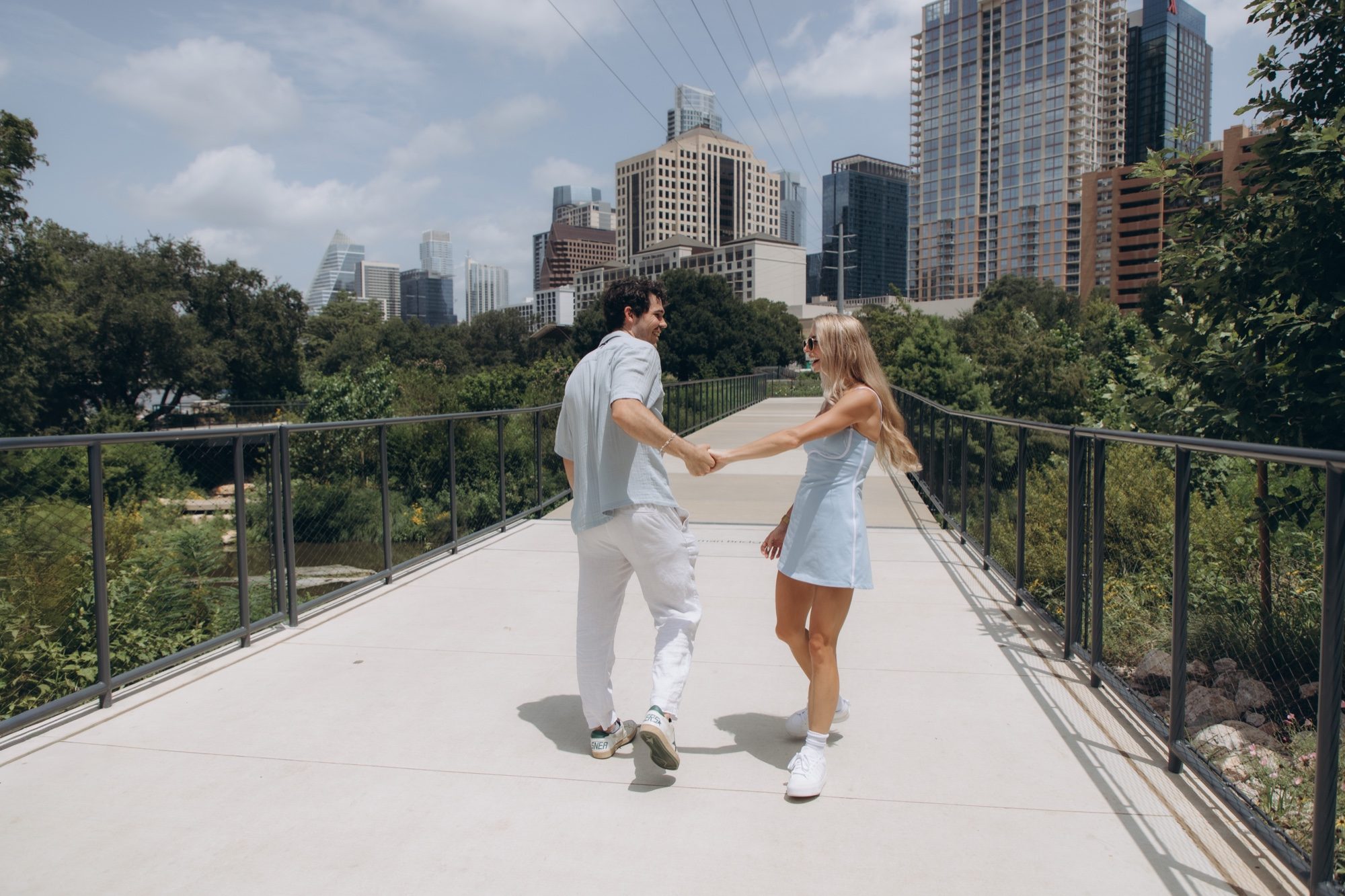 Hunter and Mary turning toward each other on the bridge with Austin behind them