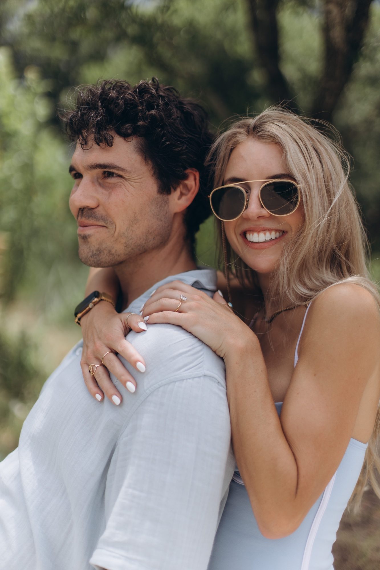Mary resting her hands on Hunter's shoulder and smiling