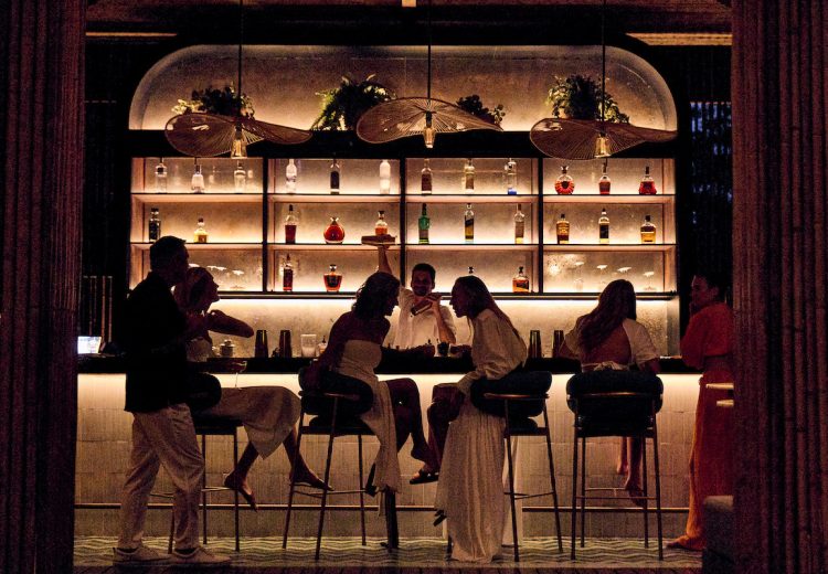 Guests gathered at a restaurant bar in Peninsula Papagayo